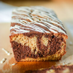 cropped image of a single loaf of chocolate and ginger cake, showcasing the marbled interior