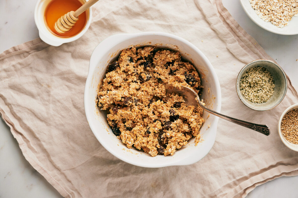 Ingredients for homemade granola bars mixed up in a bowl.