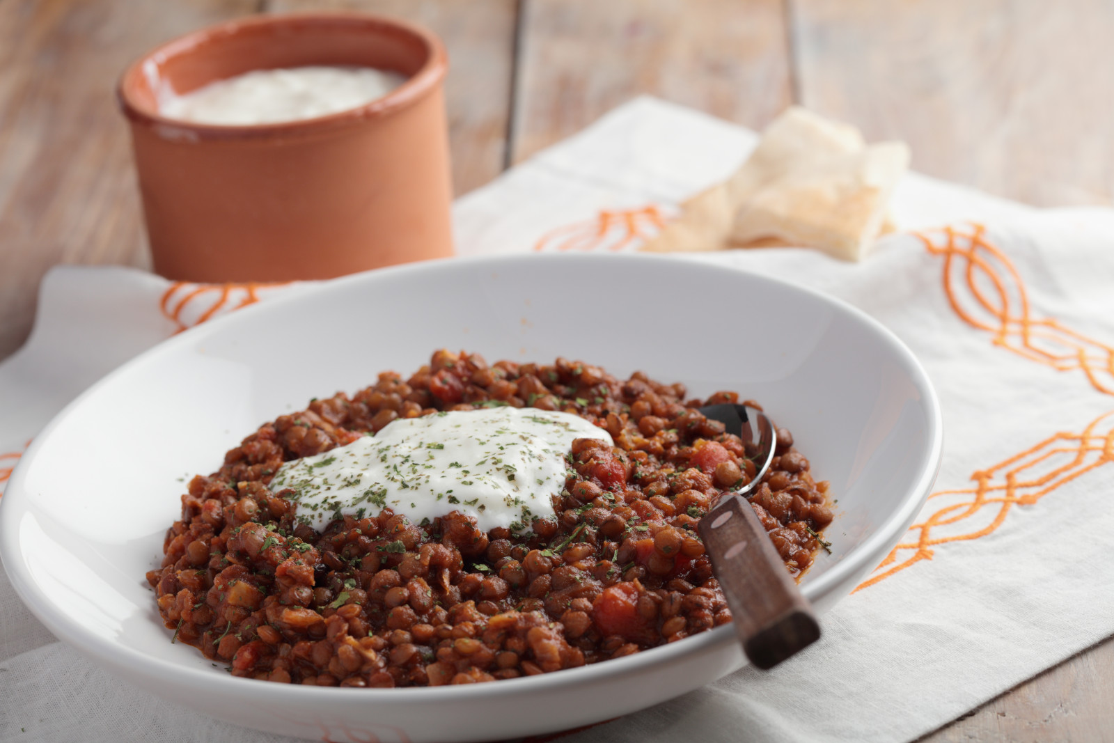 Lentil stew with yogurt and pita bread.