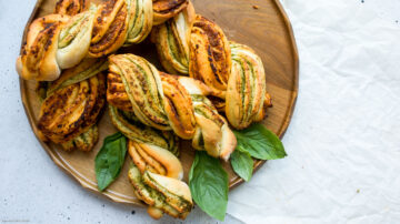 These delicious and easy two tone pesto bread twists will make any meal more interesting! Perfect for dipping in soup! Watch our video tutorial to see just how ridiculously easy it is to make these!