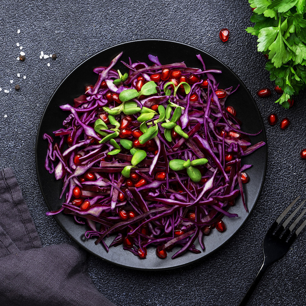 Salad with red cabbage and pomegranate seeds.