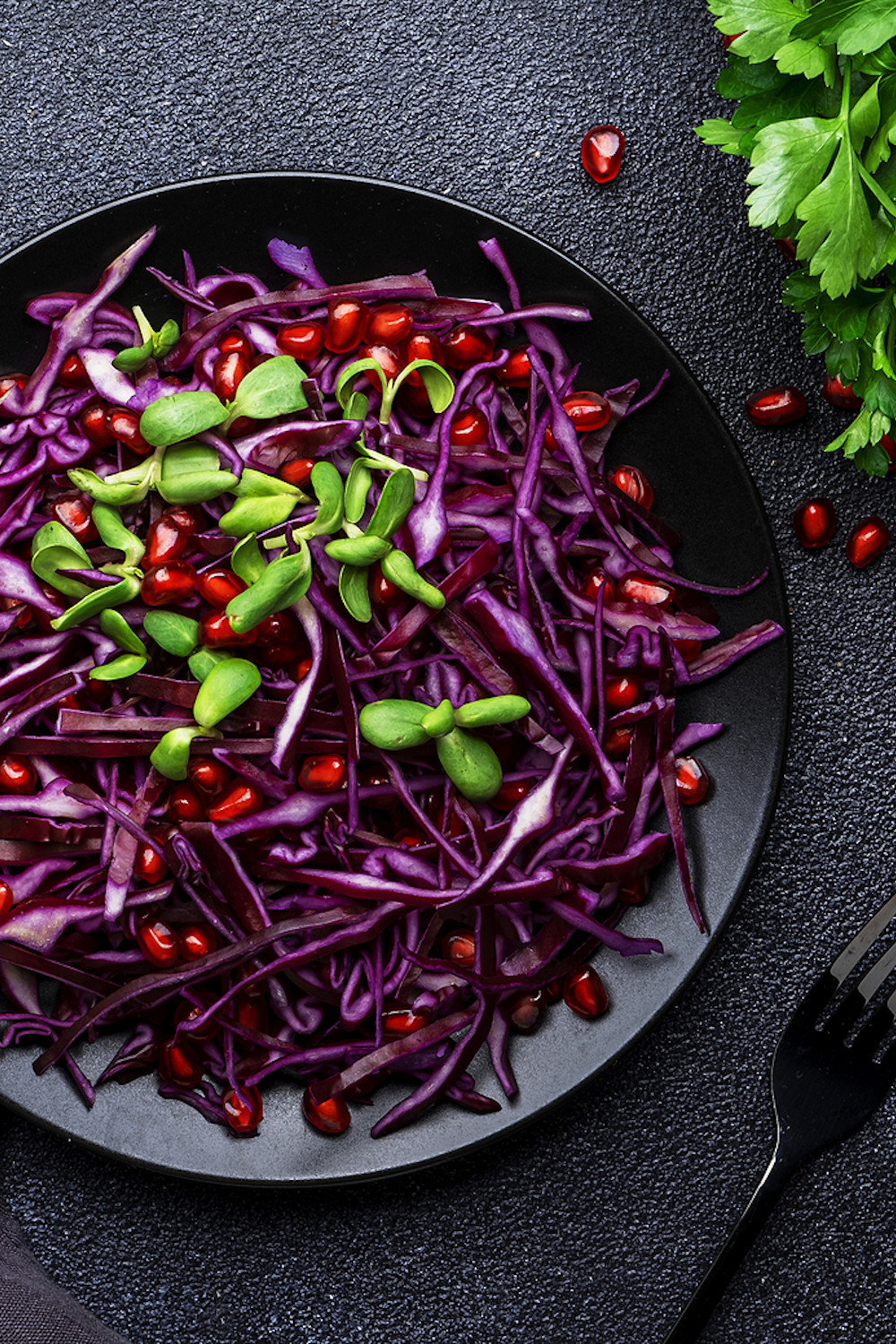 Salad with red cabbage and pomegranate seeds.