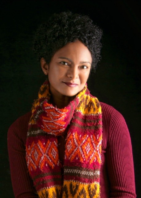 Woman in red top and colorful scarf