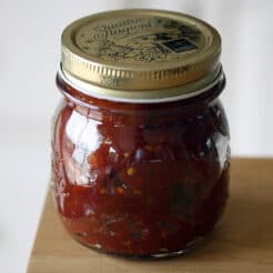 A sealed jar of Tomato Ginger Jam.