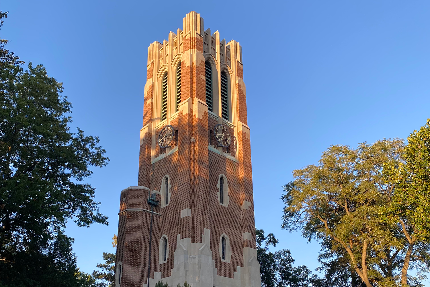 A view of Beaumont Tower, with blue sky in background. 