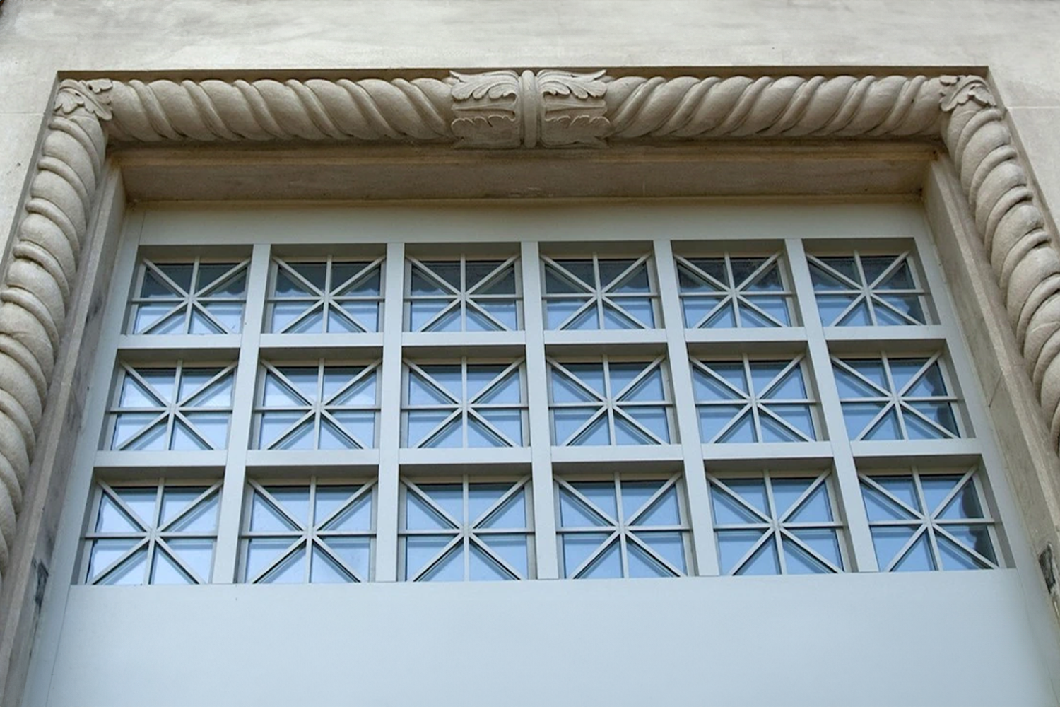 A window in a carved stone frame