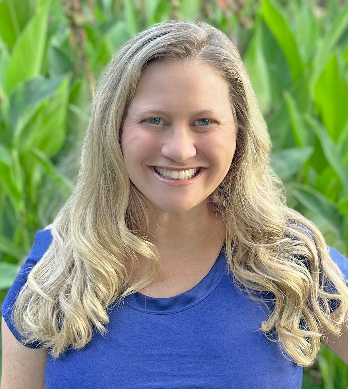 Mollie Newman, a woman with long blonde hair and a blue shirt