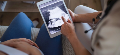 Two people reviewing an ultrasound picture