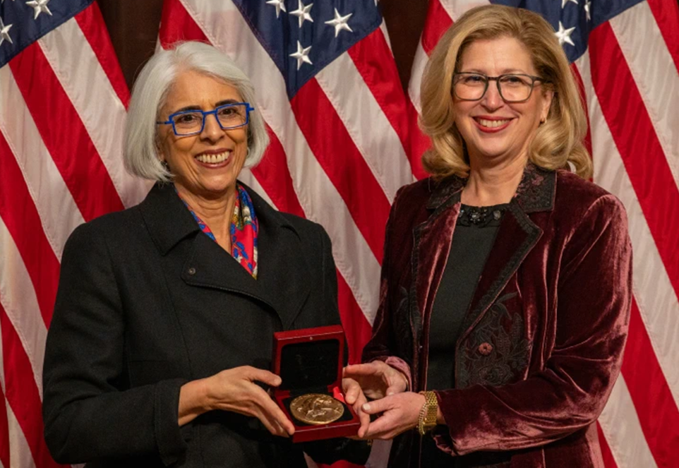 Arati Prabhakar (left) presenting Teresa Woodruff (right) with the National Medal of Science. 